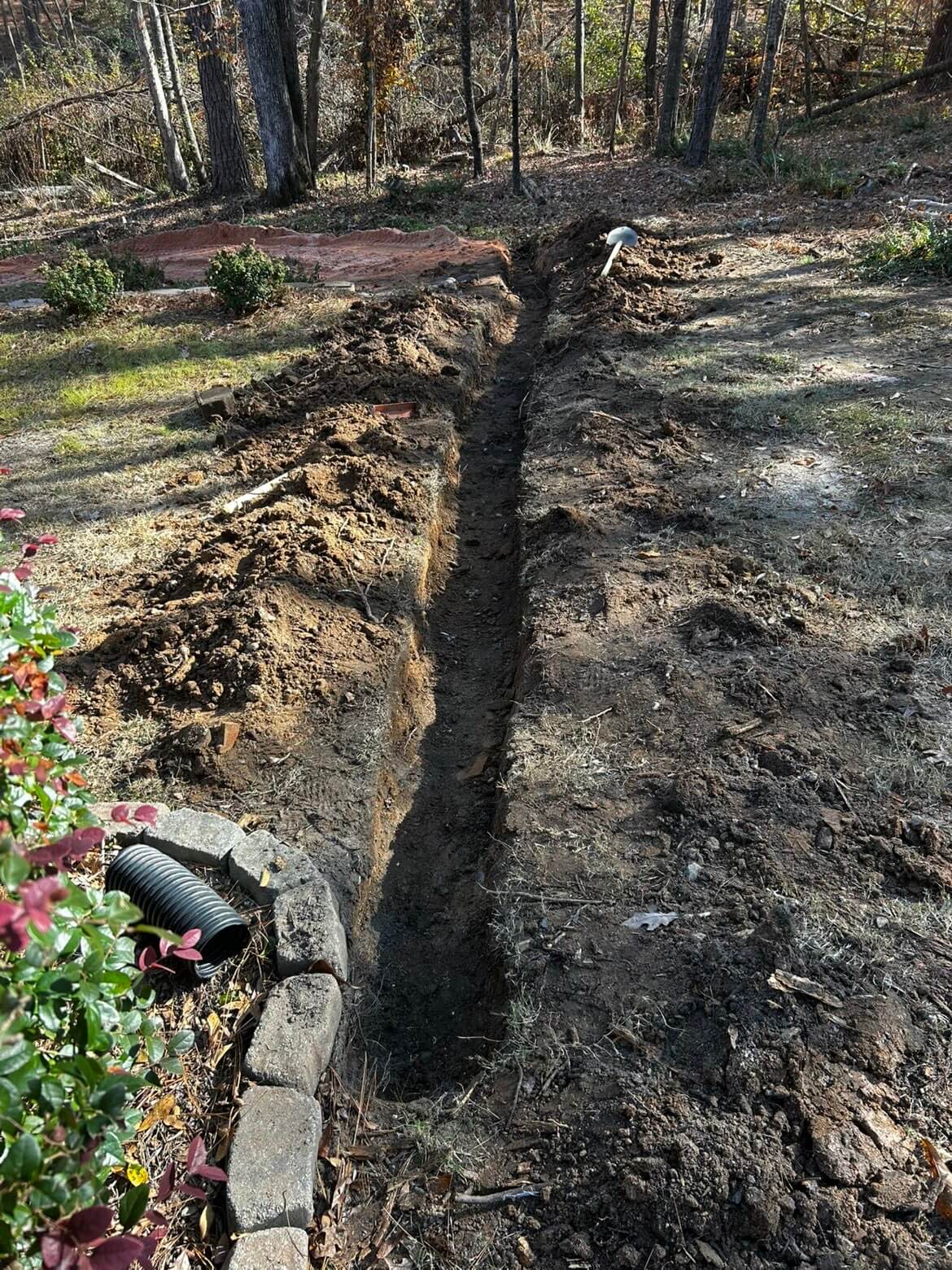 Before: yard before Norris Solutions landscaping work